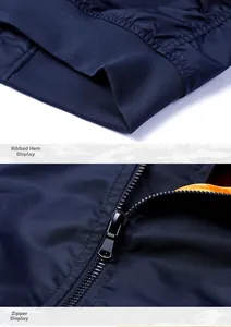 Close-up of ribbed hem and black metallic zipper on windproof baseball jacket