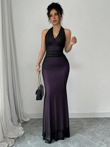 Detail of deep purple gradient satin dress with halter neck and pleated waistline