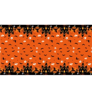 Detail of Halloween spider web tablecloth with orange haunted house and bats patterns