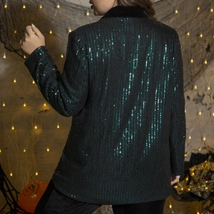 Back view of slim fit dark green sequin blazer for women in festive party setting