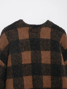 Detailed view of checkered knit cardigan collar and soft mohair texture in brown and black