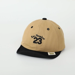 Detail of baby soft brim baseball cap with number 23 embroidery and color block design