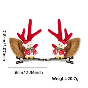 Detailed view of Christmas antler hair clips with cute penguin and reindeer ear charms