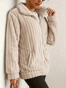 Elegant beige fuzzy jacket with striped faux fur texture and a secure zipper closure