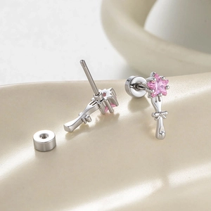 Star wand silver earrings with pink zircon stone and bow tassel details for cartilage piercing