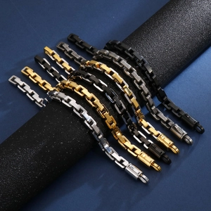 Detailed view of polished geometric square chain bracelets in gold, silver and black colors