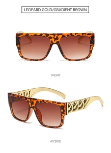 Macro detail of leopard print sunglasses with thick gold chain temples and gradient lenses