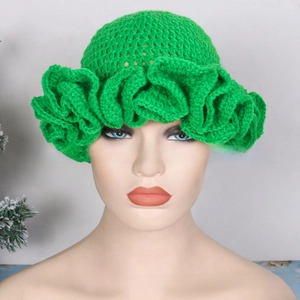 Detail of bright green crochet knit hat featuring large ruffled edges and handmade texture