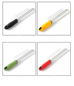 Detail of colorful stainless steel zesters with ergonomic handles and protective covers