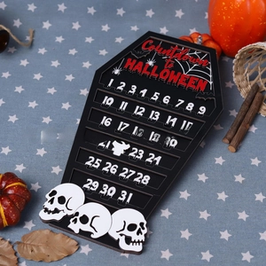 Macro shot of coffin-shaped wooden Halloween countdown calendar with skeleton details