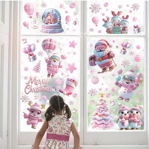 Pink Christmas window stickers with Santa, reindeer and tree decorations on glass window