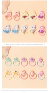 Detail of colorful mermaid and sea animal charms on elastic hair ties for kids