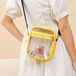 Transparent PVC crossbody jelly bag with bright yellow trim and adjustable black strap