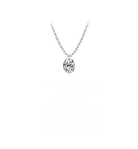 Macro detail of oval cut moissanite pendant with elegant silver ball chain necklace