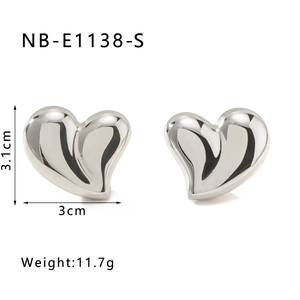 Detail of 18K gold-plated heart stud earrings with 3.1cm height and 3cm width specs