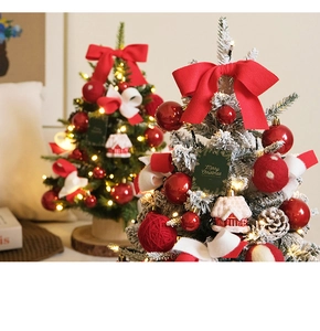 Mini Christmas trees with snowy branches, red bows, LED lights, and festive ornaments