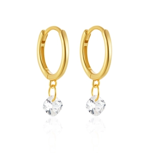 Close-up of golden S925 silver earrings featuring long tassels and cubic zirconia studs