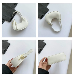 Detail shots of a white textured crescent handbag with elegant gold hardware accents