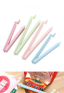 Macro detail of multi-colored plastic food sealing clips with dual-groove locking structure