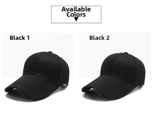 Detail view of two classic black cotton baseball caps with side brand labels on white background