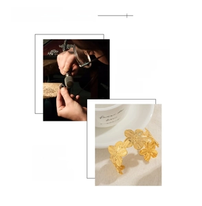 Macro detail of hand-polished 18K gold plated floral steel bracelet showing craftsmanship