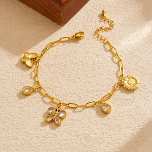 Gold stainless steel bracelet with butterfly, sunflower, and teardrop crystal charms