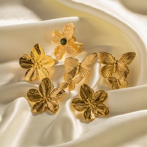 French palace style matte gold flower and butterfly rings set with turquoise inlays