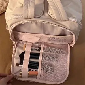 Cream puffer makeup bag featuring large capacity multi-layer storage and brush slots