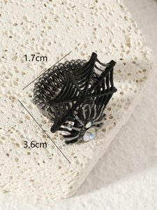 Detailed shot of black spider web ring with aurora gemstone and 3.6cm width dimensions