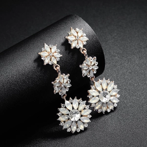 Elegant rose gold long floral drop earrings with milky opal stones and clear rhinestones