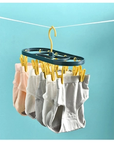 Multi-clip plastic clothes drying rack with windproof hook holding soft cotton underwear