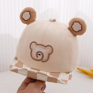 Close-up of baby bear baseball cap showing 3D plush ears and checkered brim detail