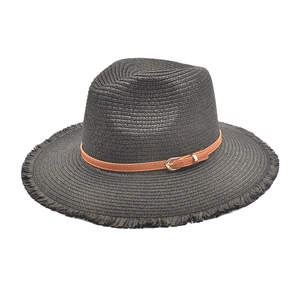 Close-up of black straw fedora hat with raw edges and brown leather buckle strap