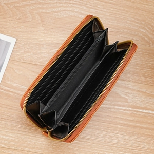 Orange faux leather long zip wallet with multiple card slots and accordion design