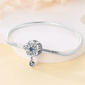 Silver snake chain bracelet with blue snowflake charm and tree of life pendant