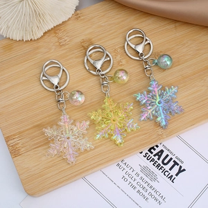 Colorful acrylic snowflake keychain with iridescent bubble charm and metal ring