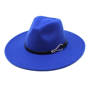 Detail of royal blue wool fedora hat featuring black leather band and silver buckle