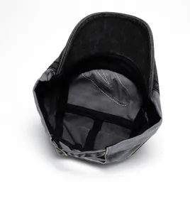 Detail showing the internal 100% cotton structure, sweatband and metal buckle of the cap