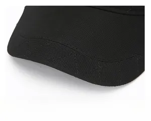 Close-up of a black winter baseball cap with diamond quilted stitching on the thick brim