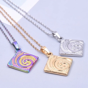 Detailed view of square pendants with spiral ripple patterns in gold, silver, and rainbow