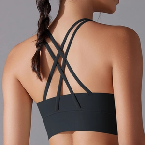 Detail of cross-back straps on black sports bra made from breathable quick-dry fabric