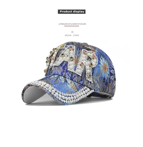 Detailed view of luxury baseball cap with pearl and rhinestone AR letter embroidery