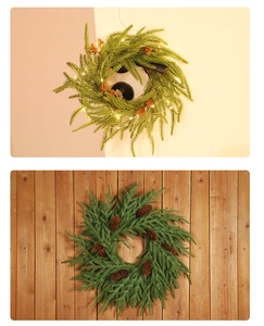 Close-up of pine needle wreath with natural cones and warm LED lights on a door