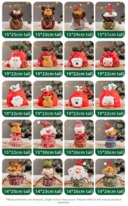 Macro view showing twenty varied 3D Christmas drawstring gift bags with cartoon designs
