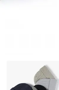 Detail of cable knit pattern and ribbed cuff on thick winter beanie hats in various colors