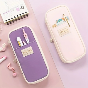 Detail of macaron purple and pink canvas pencil cases with functional front pockets