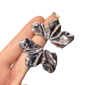 Polished silver oversized flower earrings with unique liquid wrinkle texture for women