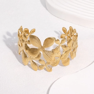 Bracciale rigido largo in acciaio inossidabile placcato oro 18k con petali di giglio