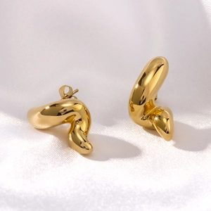 Minimalist 18K gold stainless steel geometric hoop earrings on white silk background