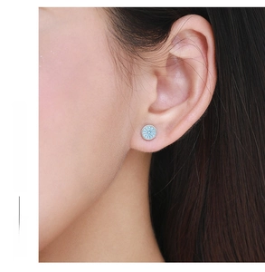 Close-up of model wearing a minimalist round turquoise stud earring in S925 sterling silver